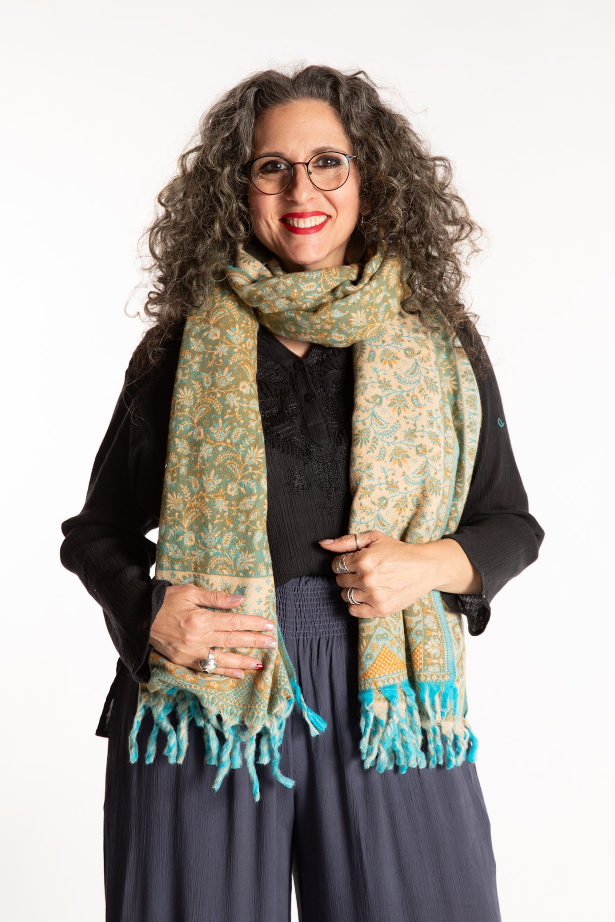 Susan is wearing the Paisley Soft Brushed Shawl in Green