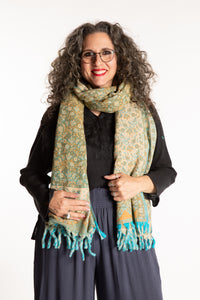 Susan is wearing the Paisley Soft Brushed Shawl in Green