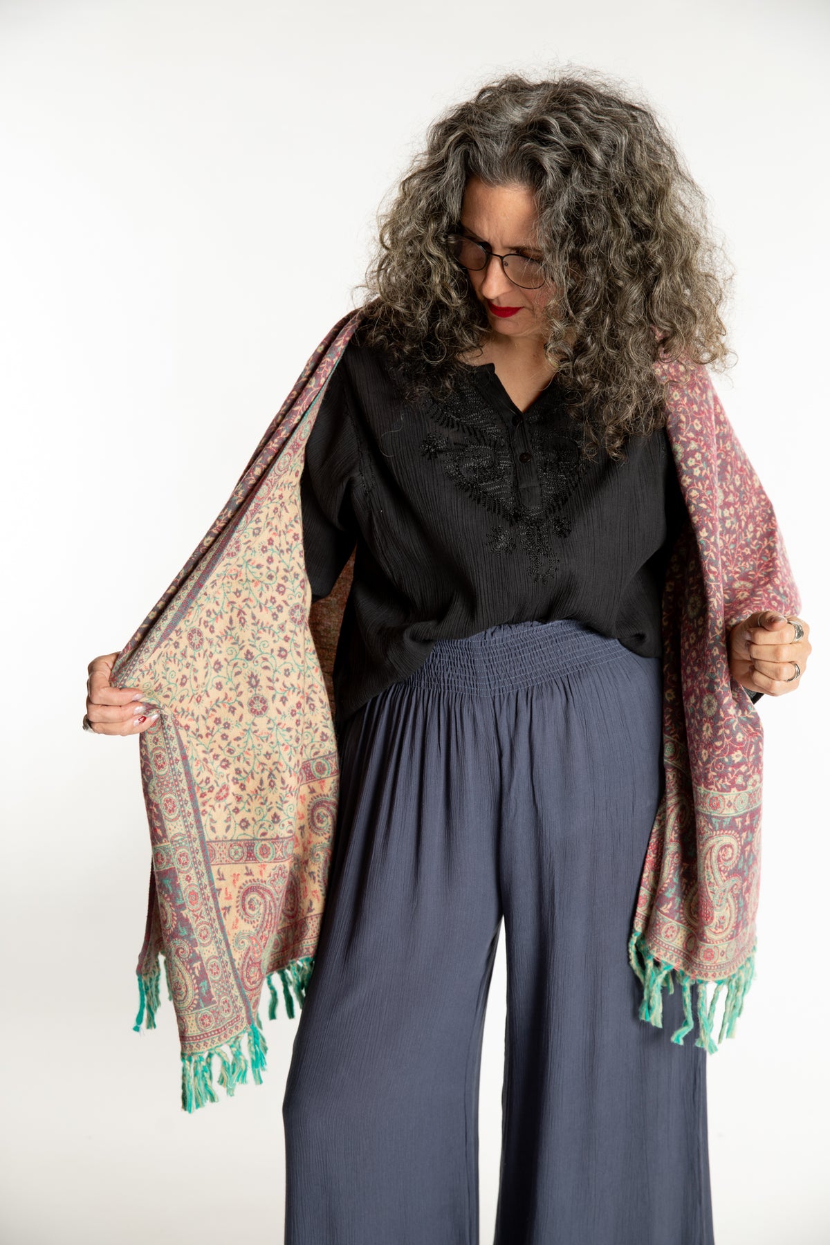 Susan is wearing the Paisley Soft Brushed Shawl in Rose