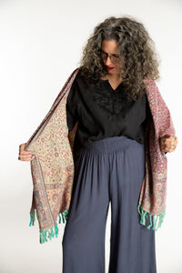 Susan is wearing the Paisley Soft Brushed Shawl in Rose