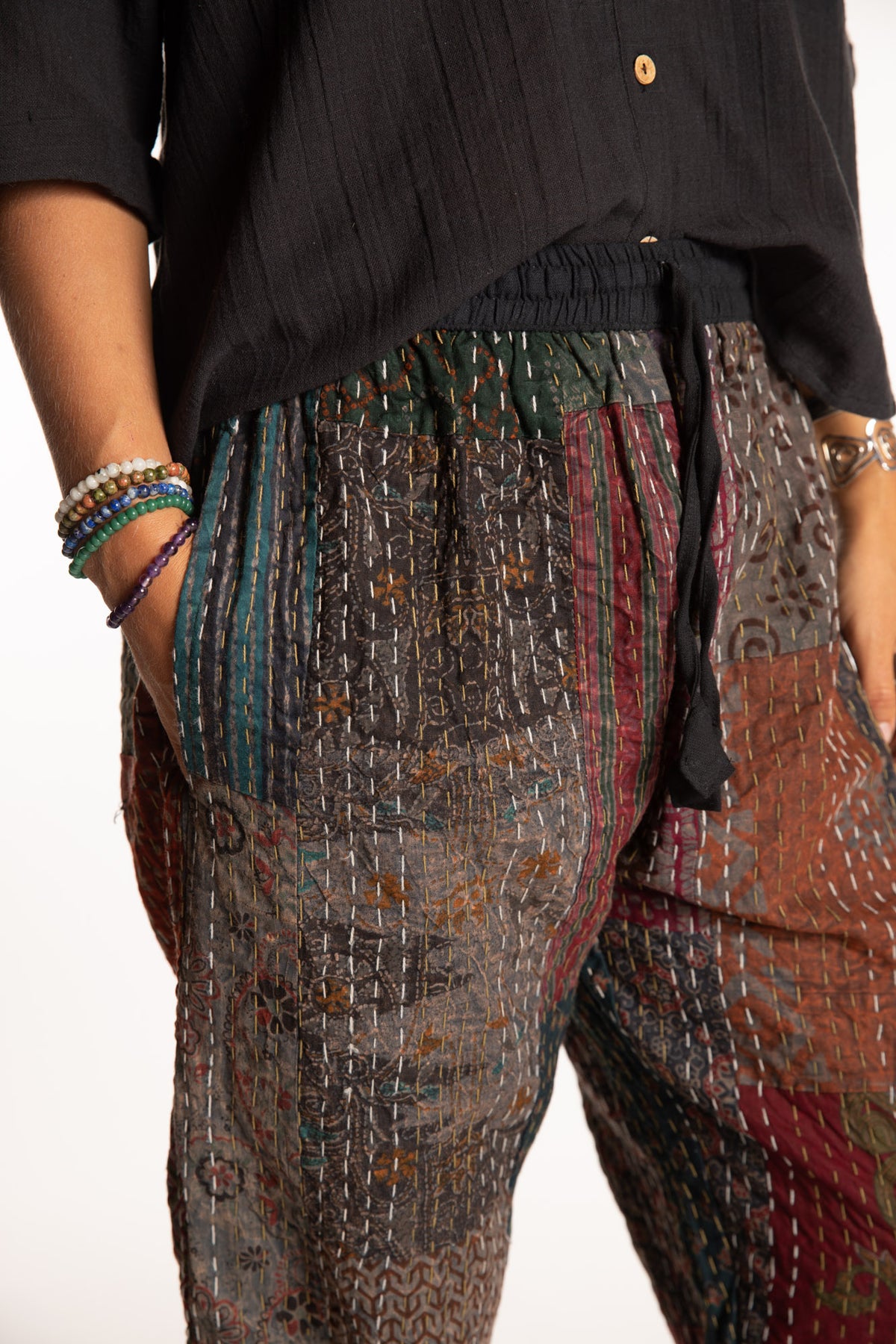 Sophie is wearing the Black Patchwork Kantha Pants in size small