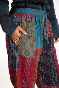 Sophie is wearing the Teal Patchwork Kantha Pants in size small