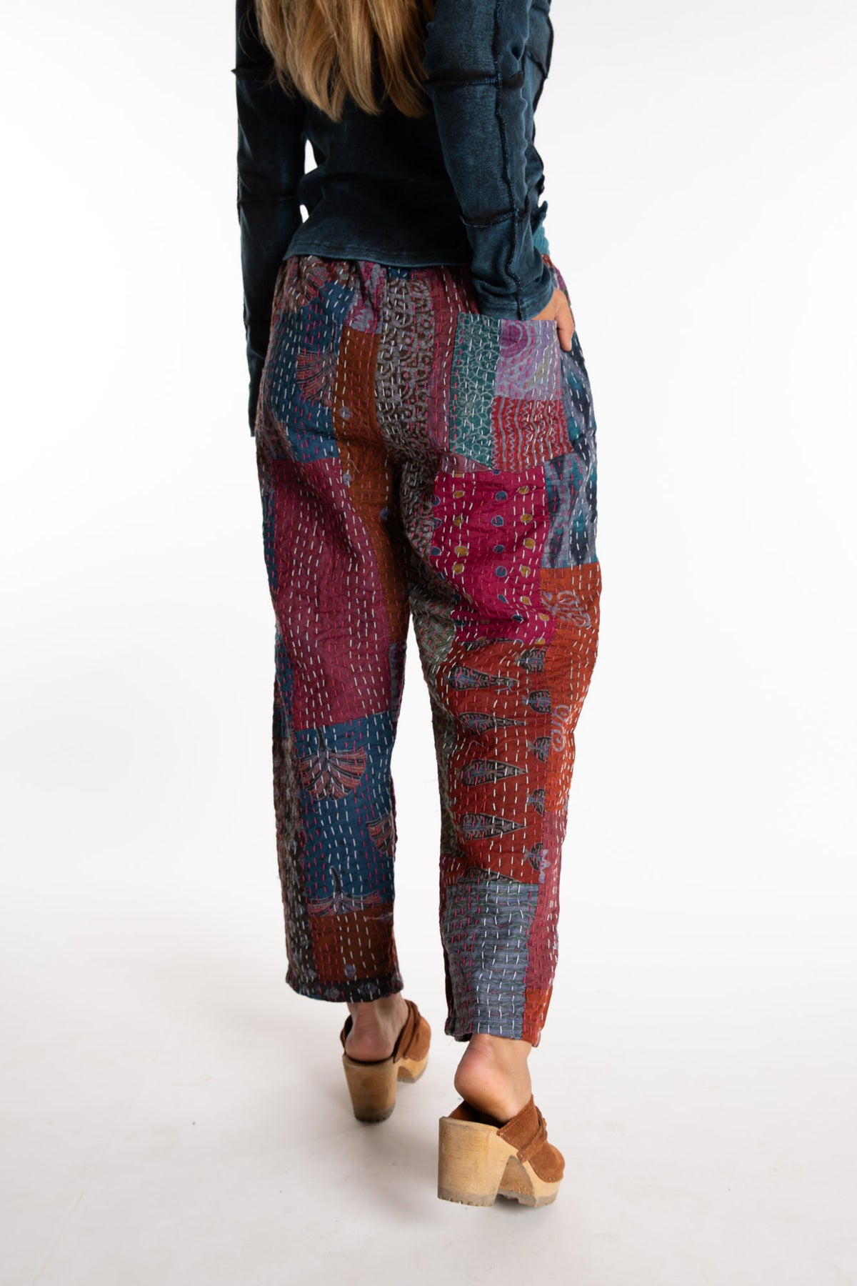 Sophie is wearing the Teal Patchwork Kantha Pants in size small