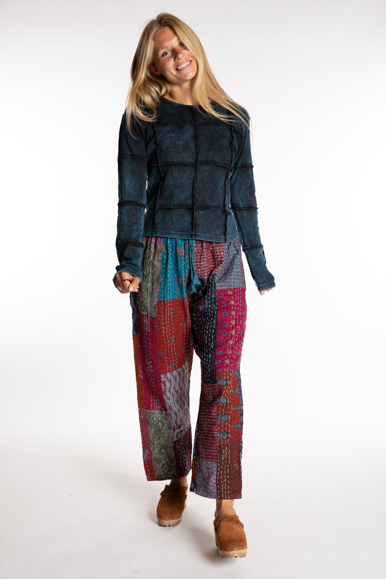 Sophie is wearing the Teal Patchwork Kantha Pants in size small