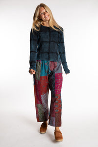 Sophie is wearing the Teal Patchwork Kantha Pants in size small