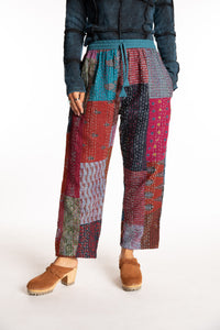 Sophie is wearing the Teal Patchwork Kantha Pants in size small