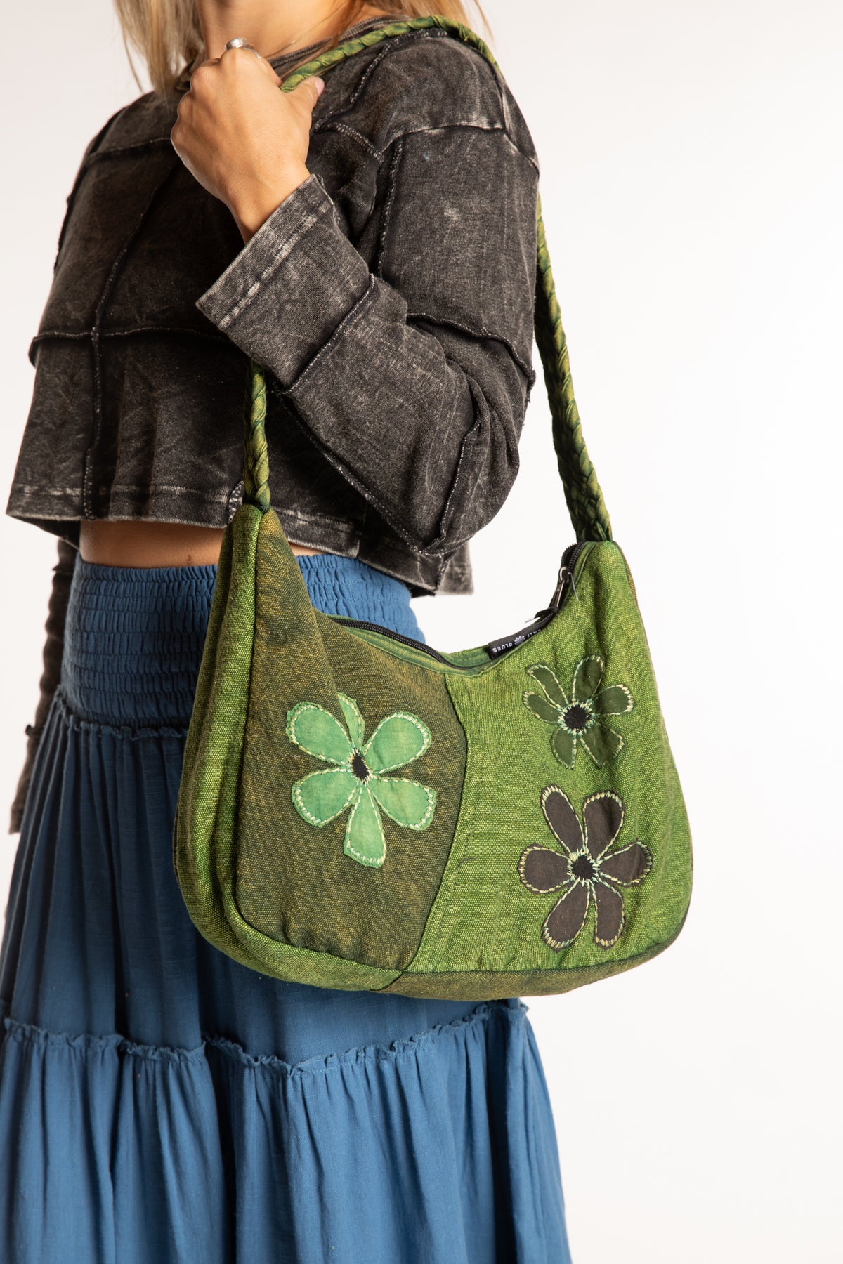 Sophie wearing green floral patchwork shoulder bag
