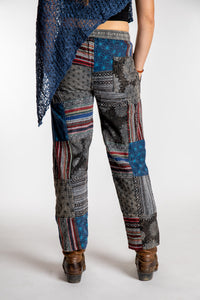 Emily is wearing the Black Patchwork Stone Wash Meditation Pants in Small