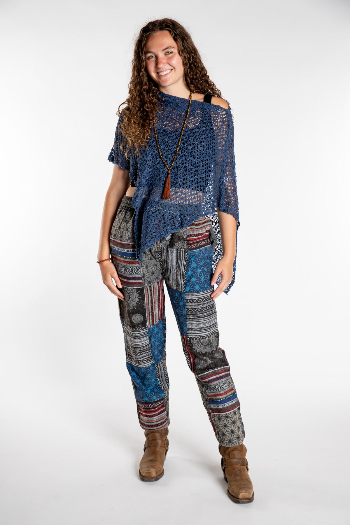 Emily is wearing the Black Patchwork Stone Wash Meditation Pants in Small