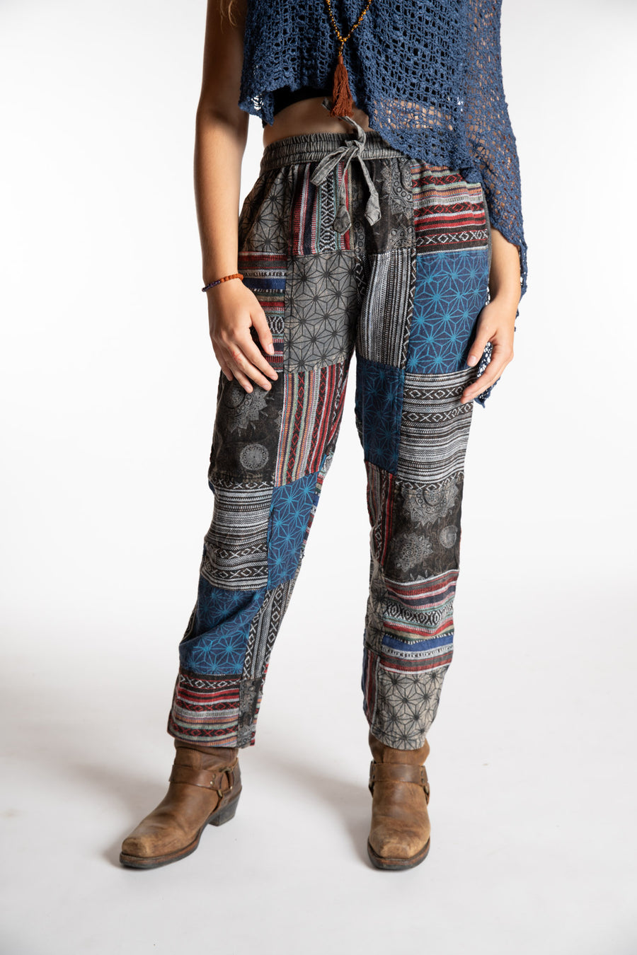 Emily is wearing the Black Patchwork Stone Wash Meditation Pants in Small