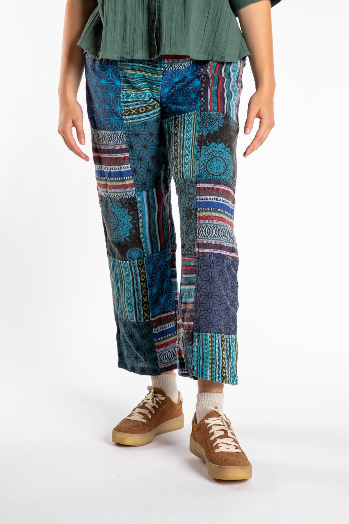 Emily is wearing the Blue Patchwork Stone Wash Meditation Pants in Small