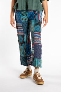 Emily is wearing the Blue Patchwork Stone Wash Meditation Pants in Small