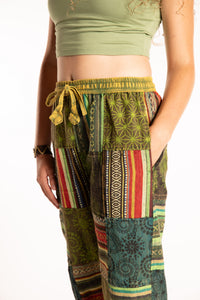 Emily is wearing the Green Patchwork Stone Wash Meditation Pants in Small