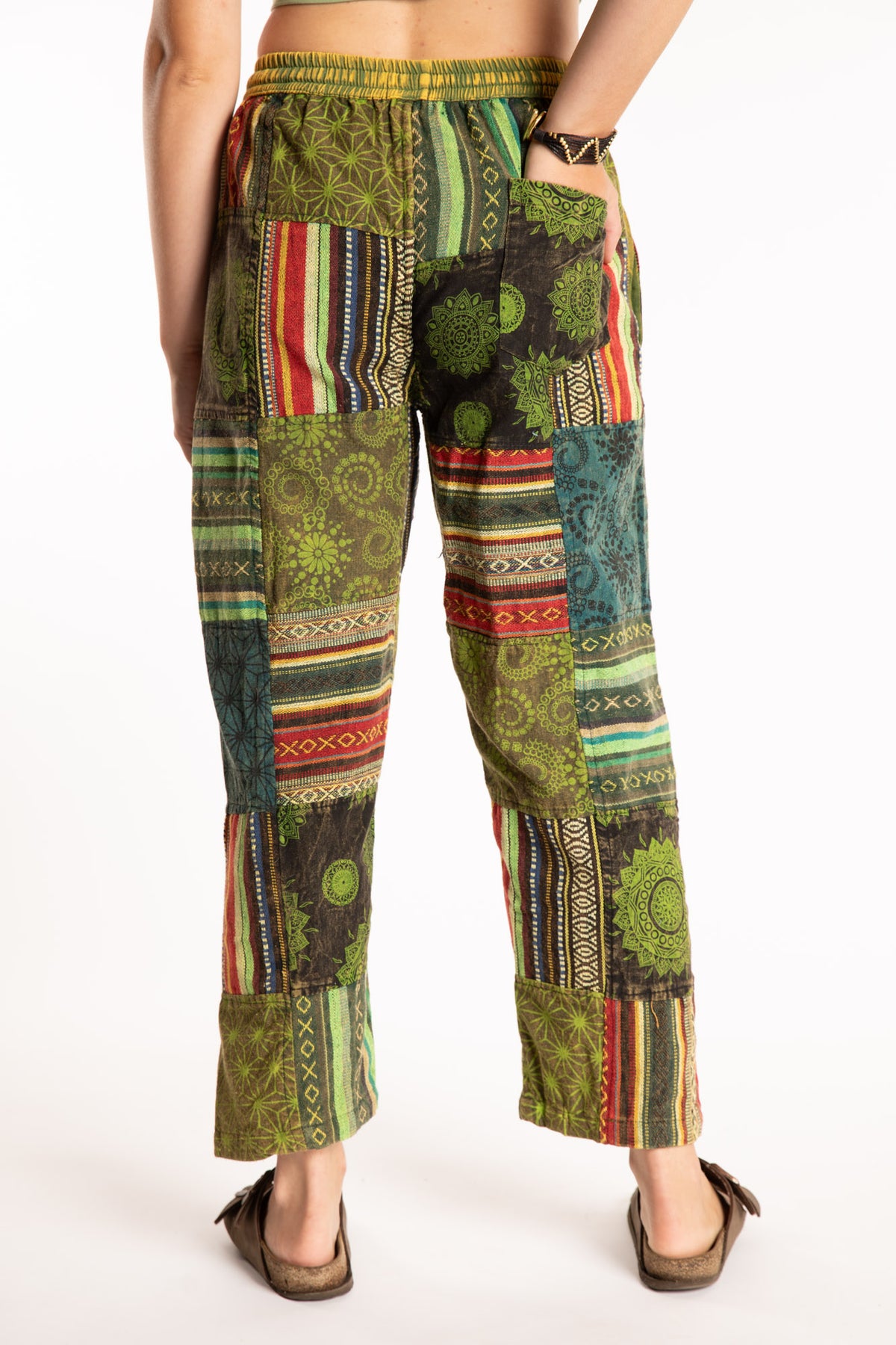 Emily is wearing the Green Patchwork Stone Wash Meditation Pants in Small