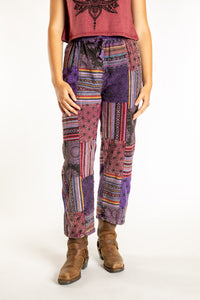 Emily is wearing the Purple Patchwork Stone Wash Meditation Pants in Small