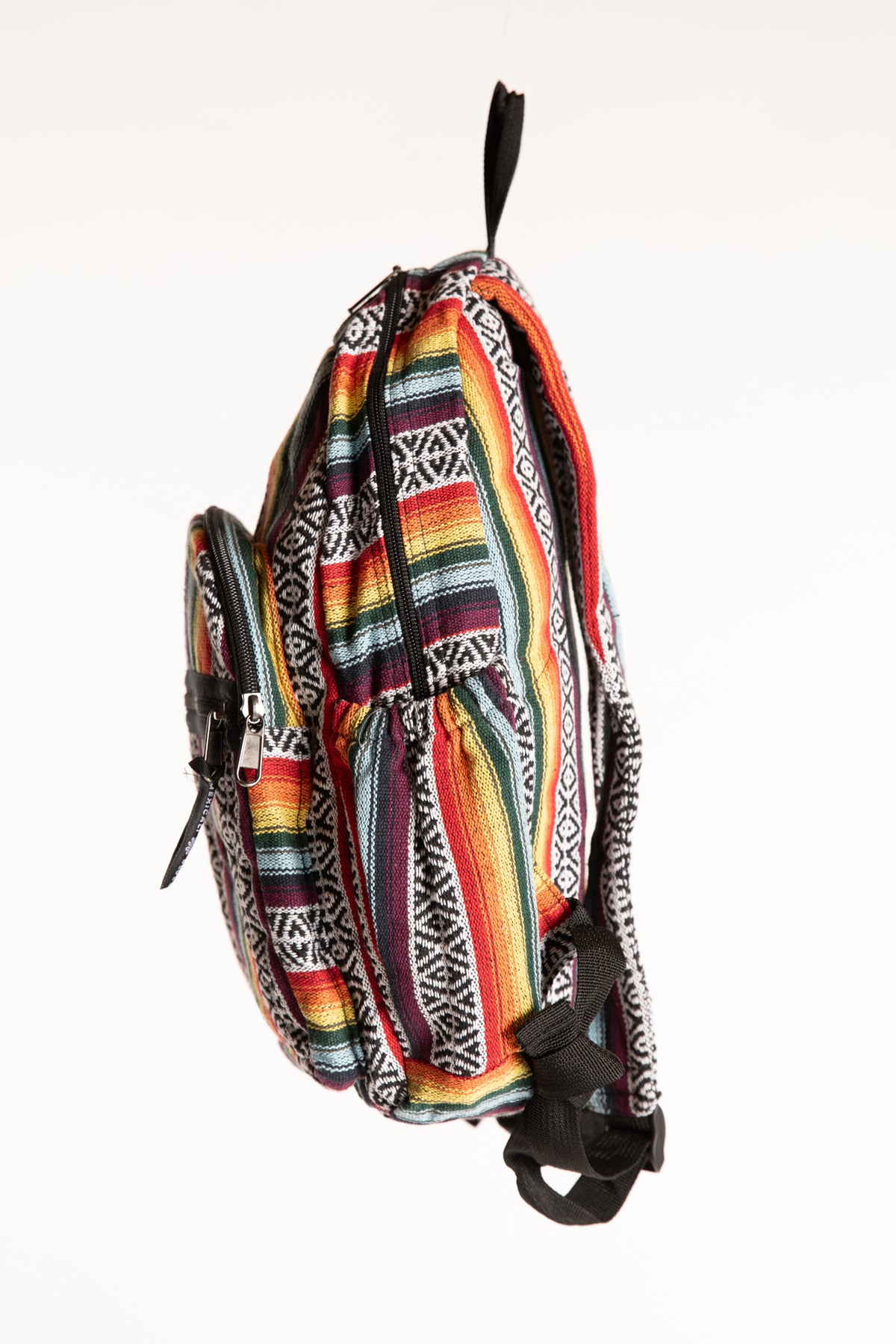 Side view of colorful striped cotton backpack with black trim and side pocket