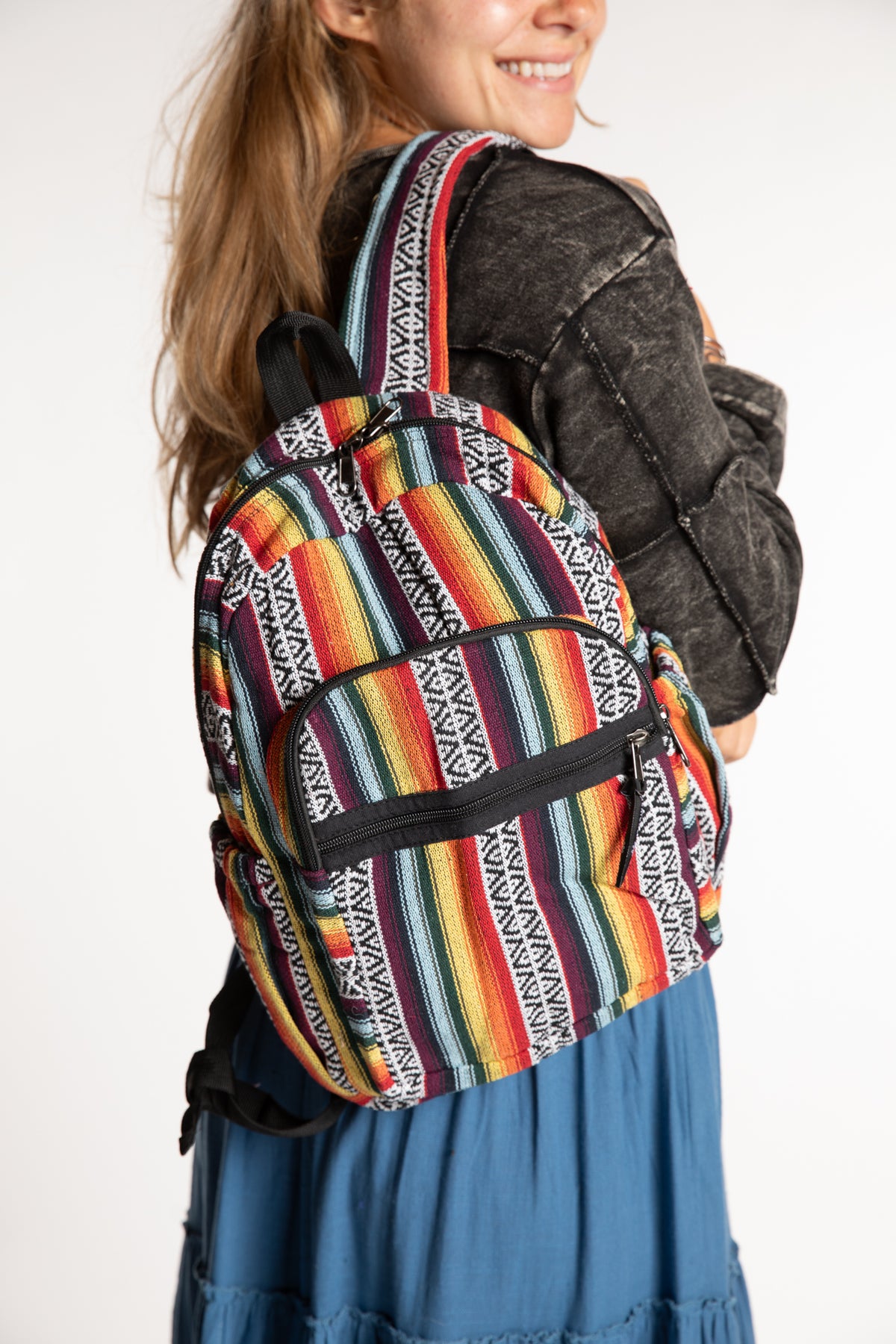 Sophie wearing colorful striped Gheri backpack with adjustable shoulder straps