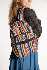 Sophie wearing colorful striped Gheri backpack with adjustable shoulder straps