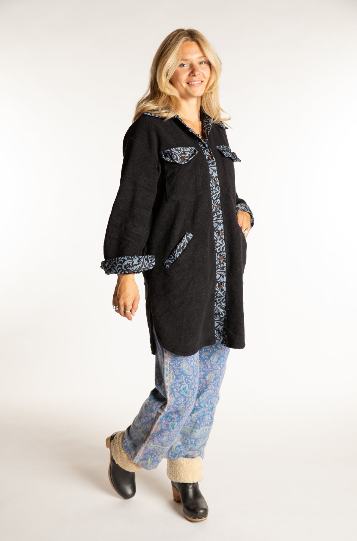 Sophie is wearing the S/M Priya Sari Patch Fleece Jacket in Black 