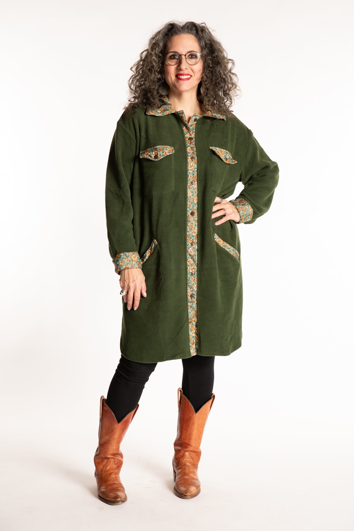 Susan is wearing the M/L Priya Patch Fleece Jacket in Green