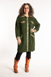 Susan is wearing the M/L Priya Patch Fleece Jacket in Green