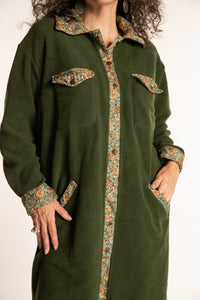 Susan is wearing the M/L Priya Patch Fleece Jacket in Green