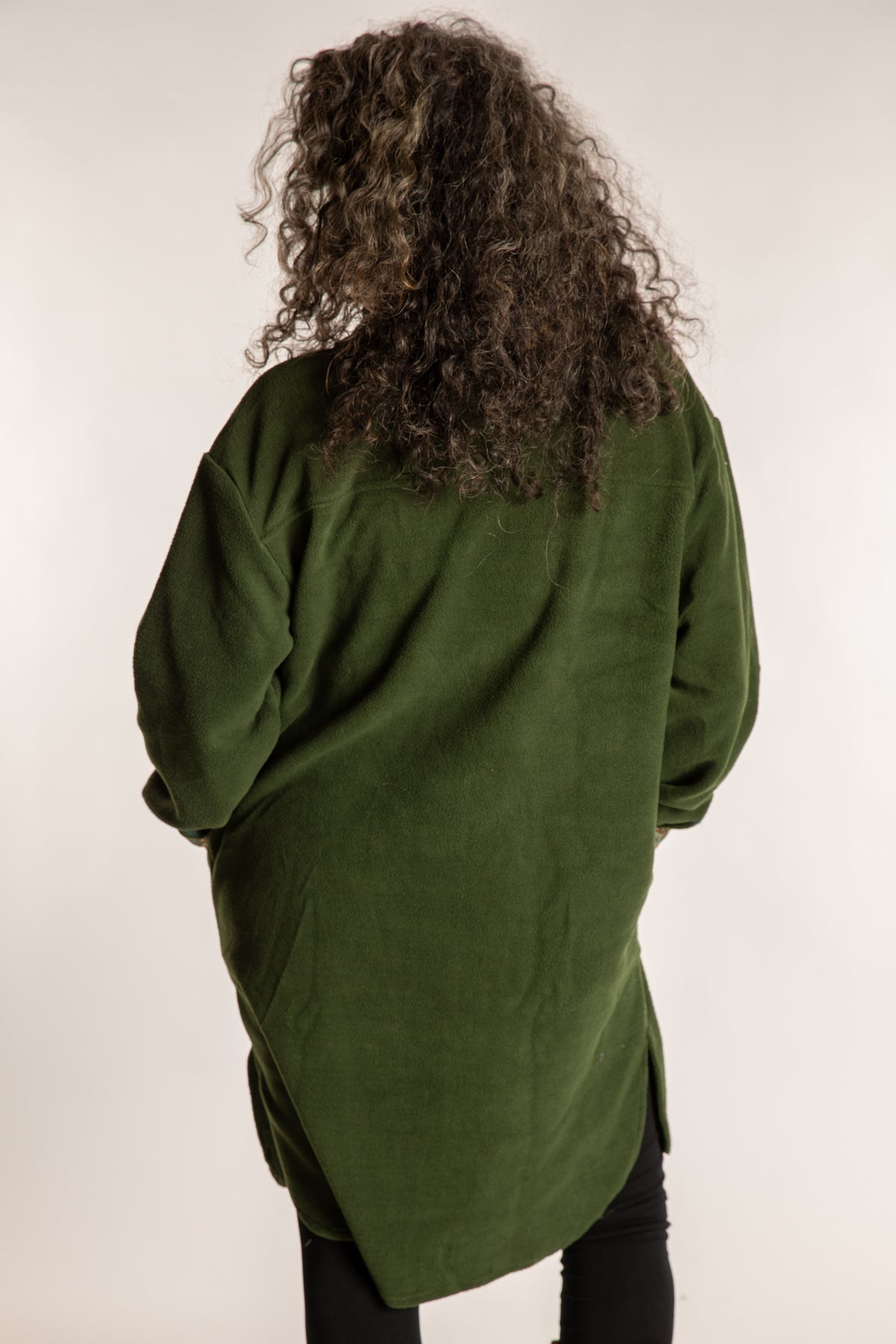 Susan is wearing the M/L Priya Patch Fleece Jacket in Green