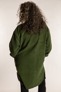 Susan is wearing the M/L Priya Patch Fleece Jacket in Green