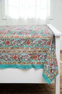 Bohemian block print tapestry in Bittersweet Brambles, displayed as a bedspread