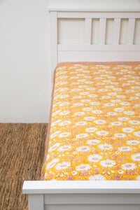 Bohemian block print tapestry in Halcyon Daydream, displayed as a bedspread