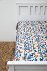 Bohemian block print tapestry in Trailing Opulence, displayed as a bedspread