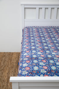 Bohemian block print tapestry in US Blues, displayed as a bedspread