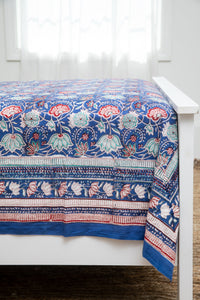 Bohemian block print tapestry in US Blues, displayed as a bedspread