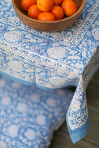 Bohemian block print tapestry in Blue Poppies, displayed as a tablecloth