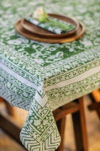 Bohemian block print tapestry in Forest Peonies, displayed as a tablecloth