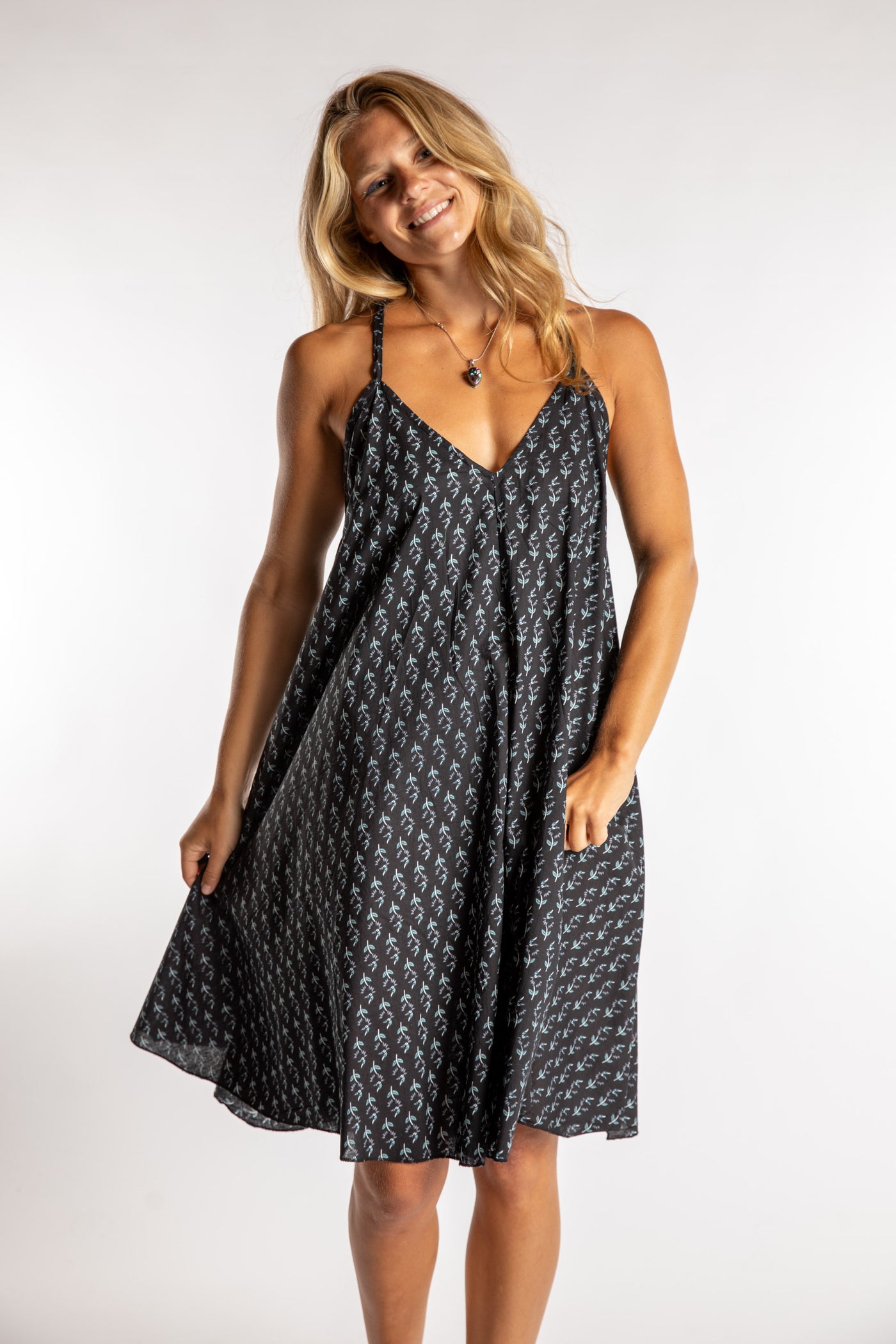 Sophie is wearing the one size Puri Printed Cotton Dress in Black