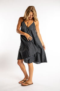 Sophie is wearing the one size Puri Printed Cotton Dress in Black