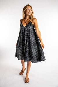 Sophie is wearing the one size Puri Printed Cotton Dress in Black