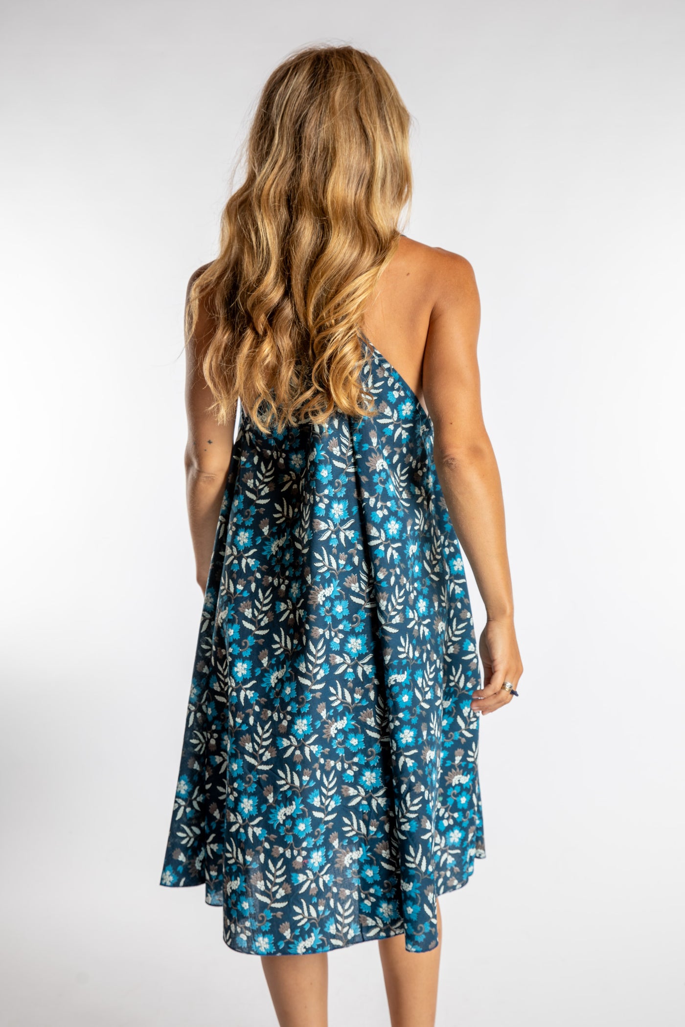 Sophie is wearing the one size Puri Printed Cotton Dress in Navy
