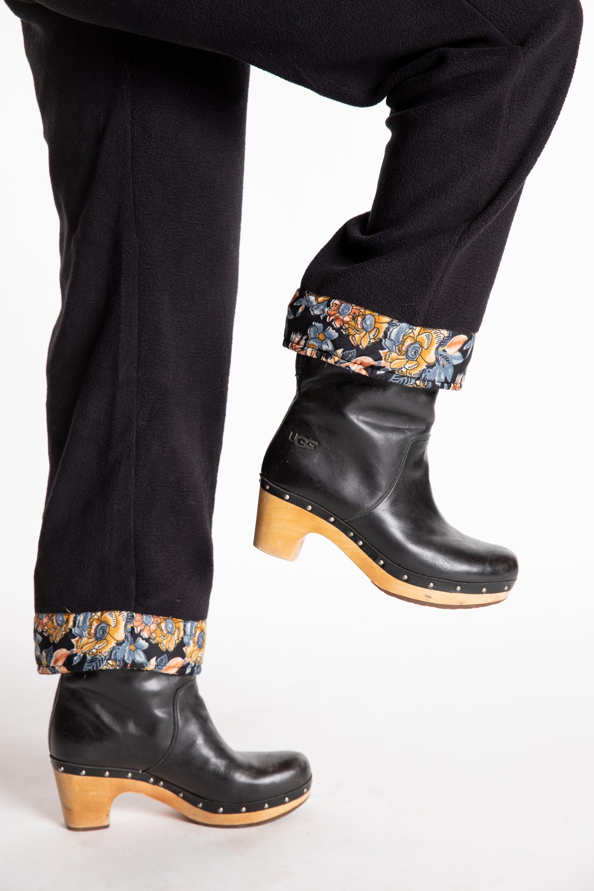Sophie is wearing the S/M Ravi Sari Patch Fleece Pants in Black