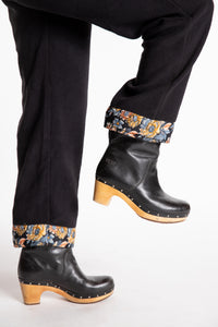 Sophie is wearing the S/M Ravi Sari Patch Fleece Pants in Black