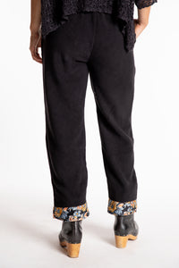 Sophie is wearing the S/M Ravi Sari Patch Fleece Pants in Black
