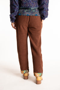 Sophie is wearing the S/M Ravi Sari Patch Fleece Pants in Brown