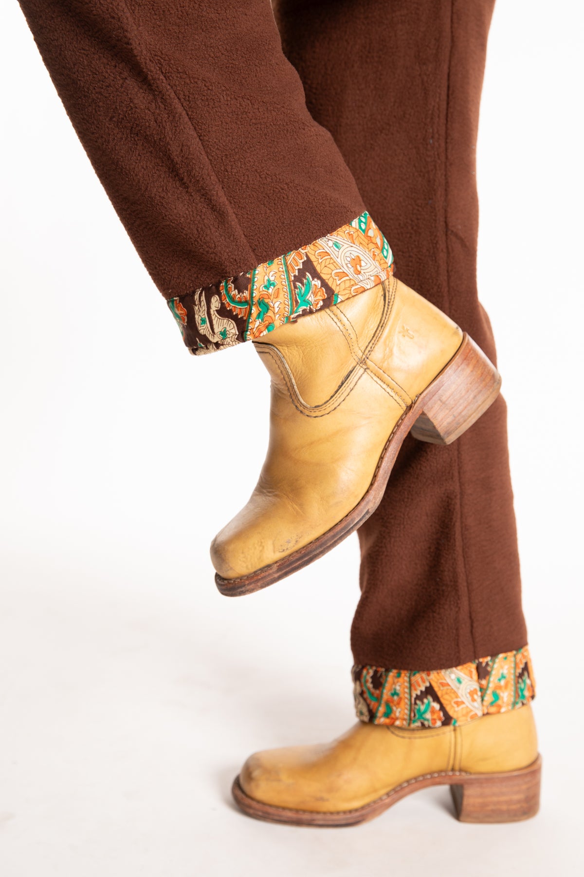 Sophie is wearing the S/M Ravi Sari Patch Fleece Pants in Brown