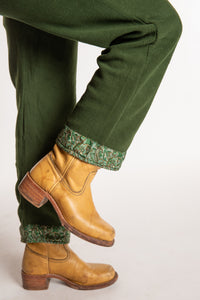 Sophie is wearing the S/M Ravi Sari Patch Fleece Pants in Green