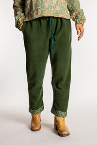 Sophie is wearing the S/M Ravi Sari Patch Fleece Pants in Green
