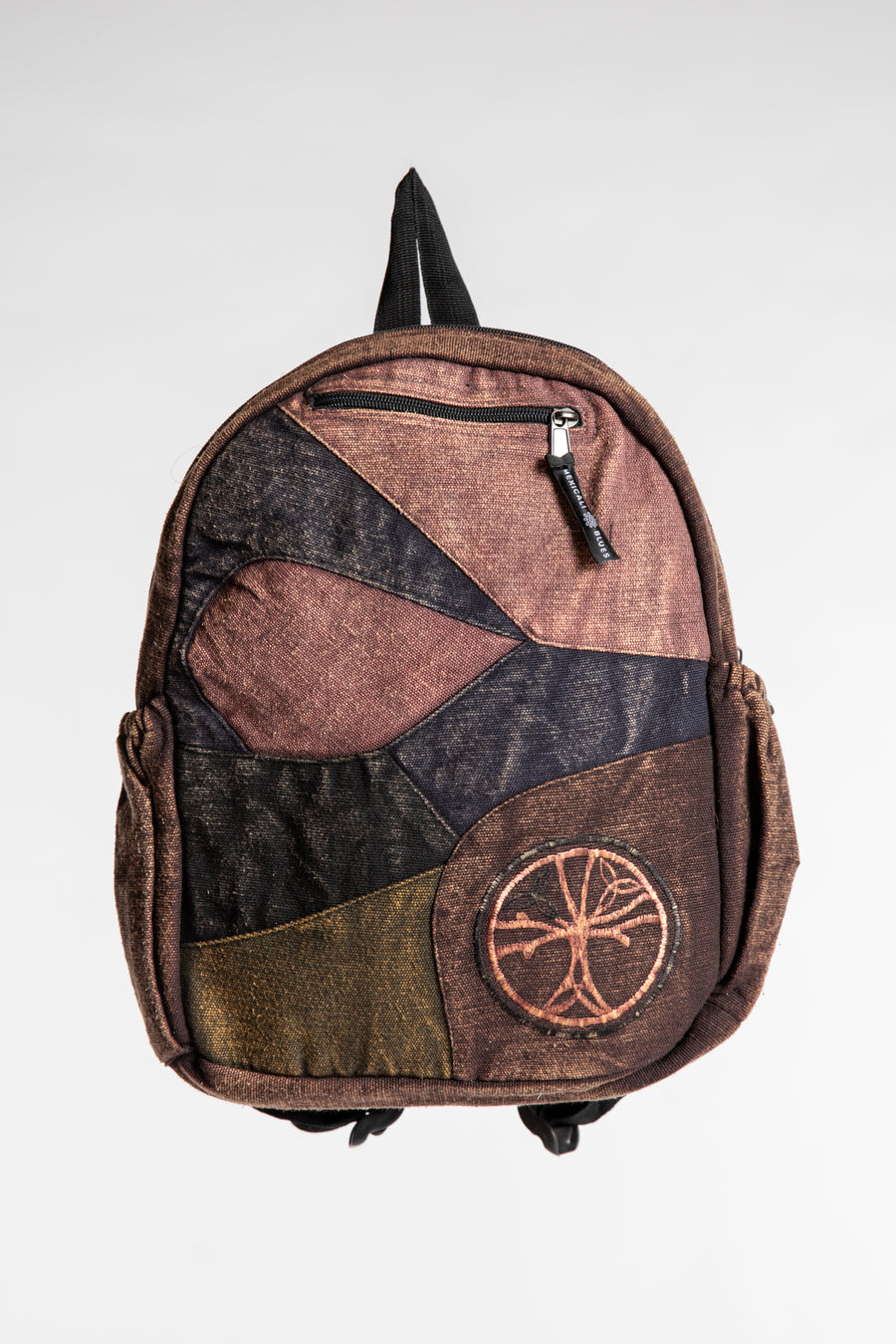 Brown patchwork cotton backpack with black trim, circular design and front zipper pockets