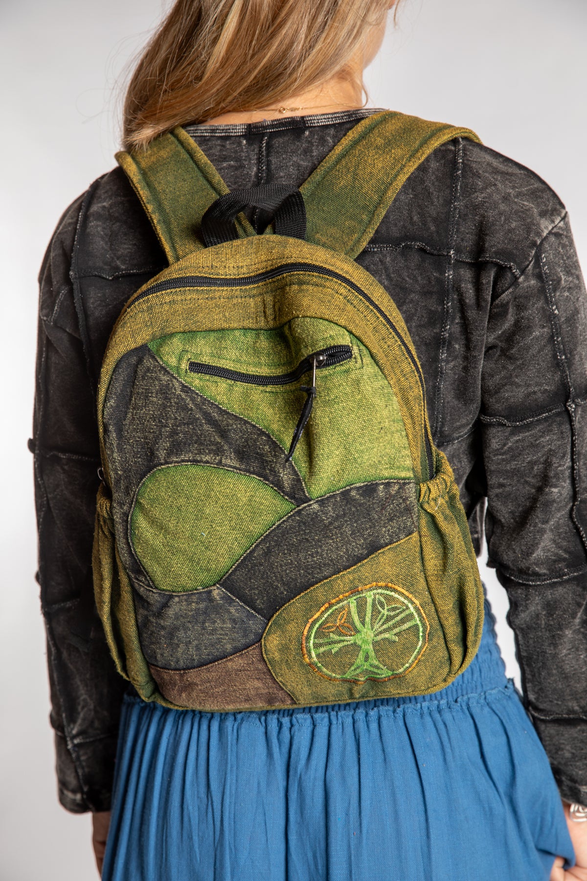 Sophie is wearing the green ridgeline patchwork mini backpack