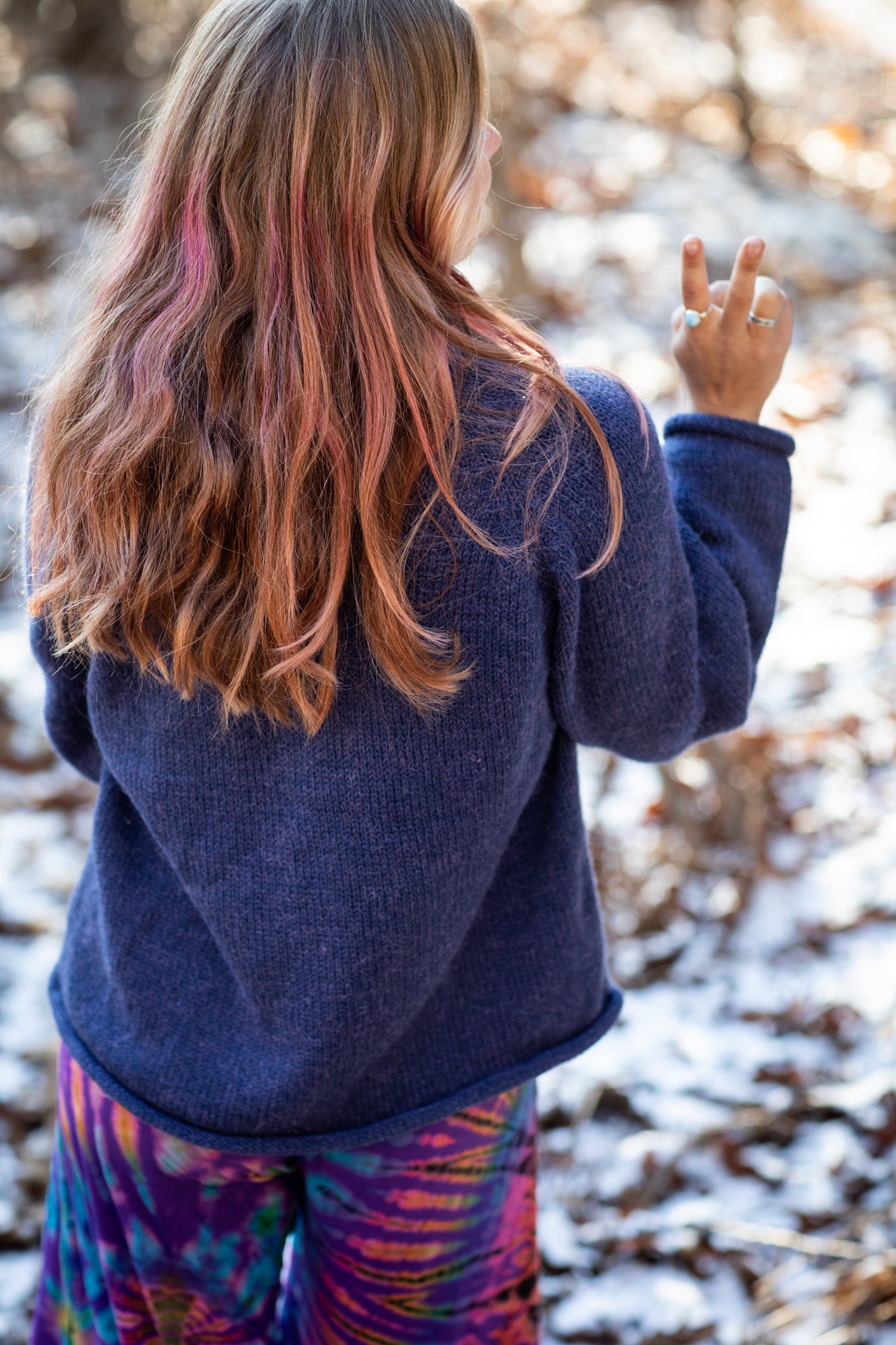 Sophie is wearing size S roll neck alpaca sweater in denim