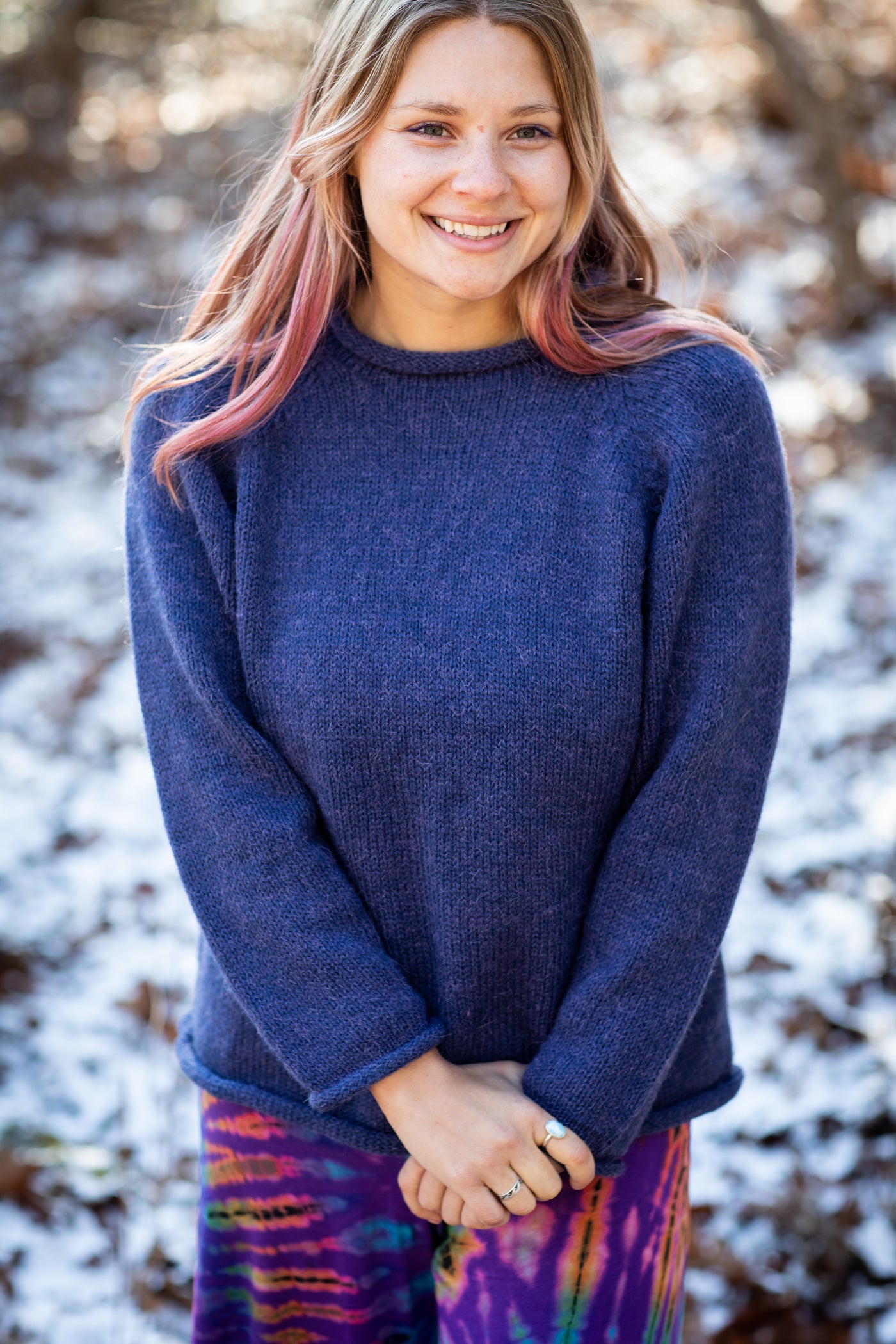 Sophie is wearing size S roll neck alpaca sweater in denim